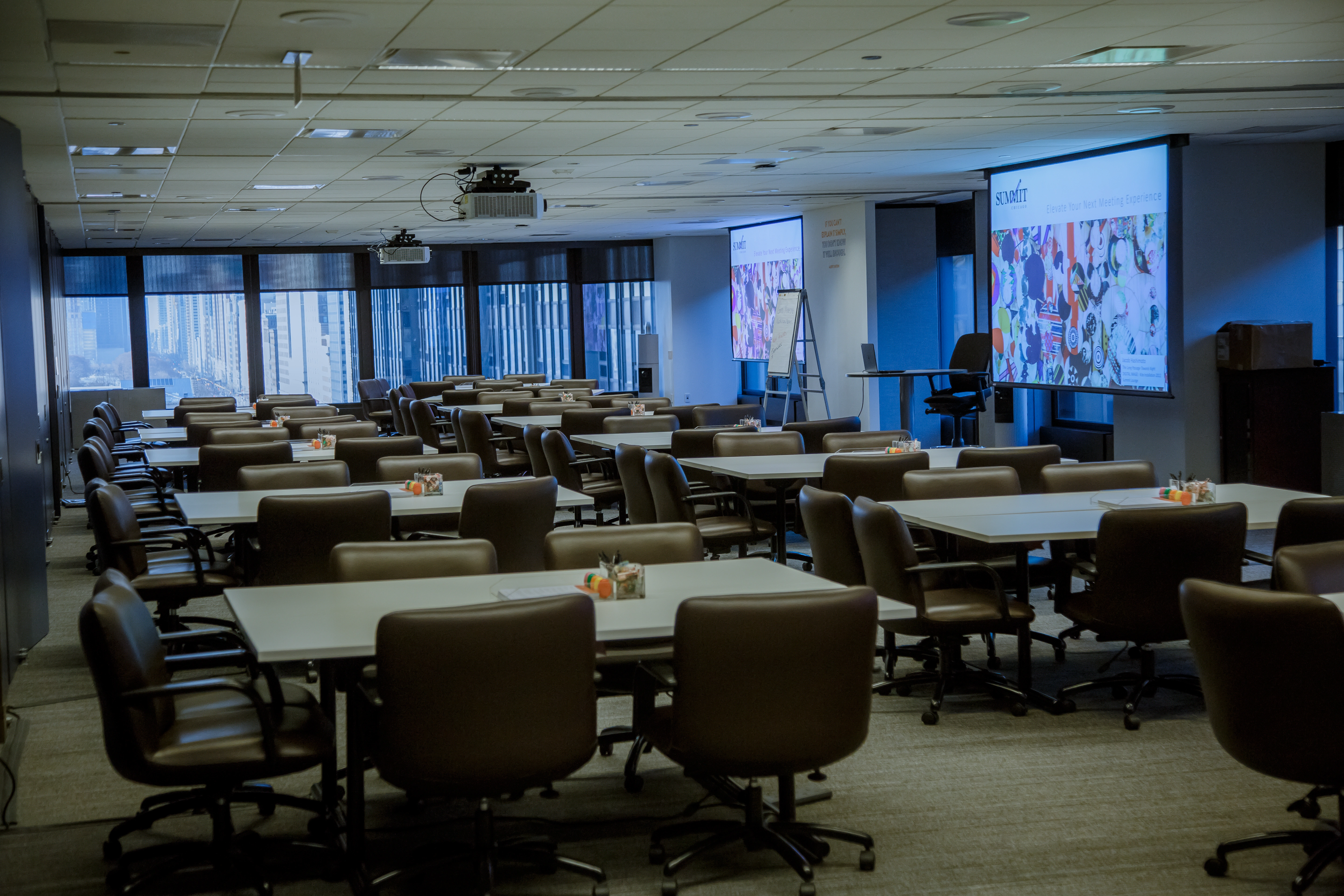 Summit Chicago training room with attendees seated at tables during a corporate workshop.